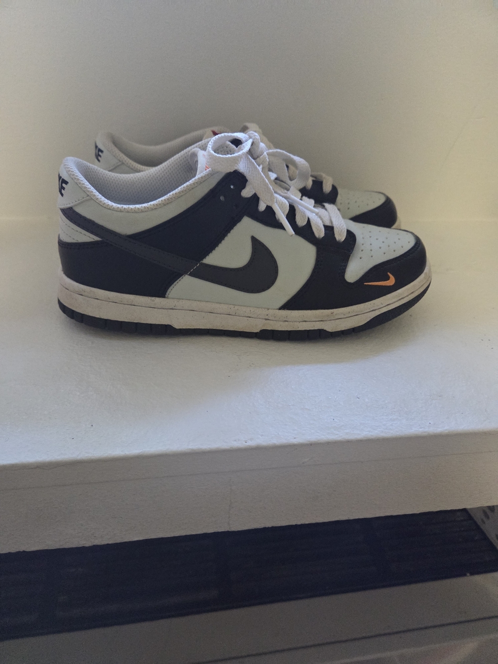 Nike Dunk Low Sneakers in Black, White & Light Gray with Orange Accent